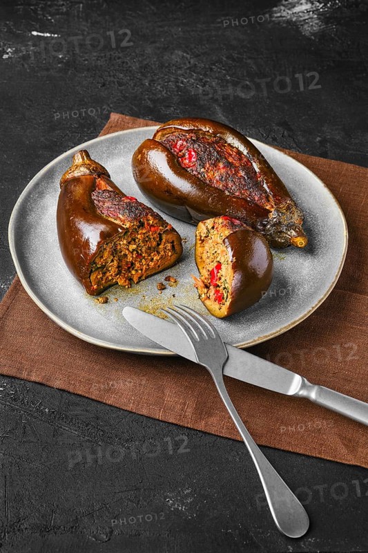 Aubergine filled with meat baked in oven