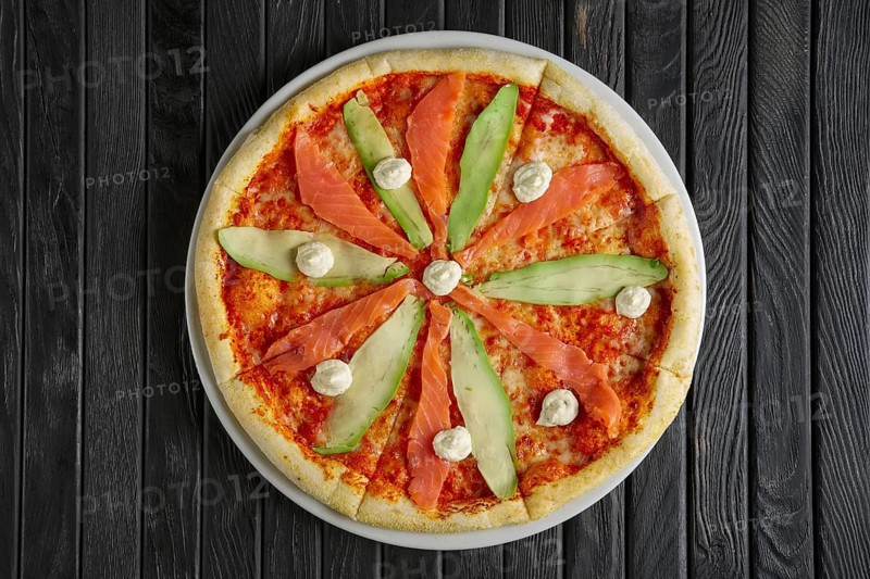 Pizza with salmon and avocado