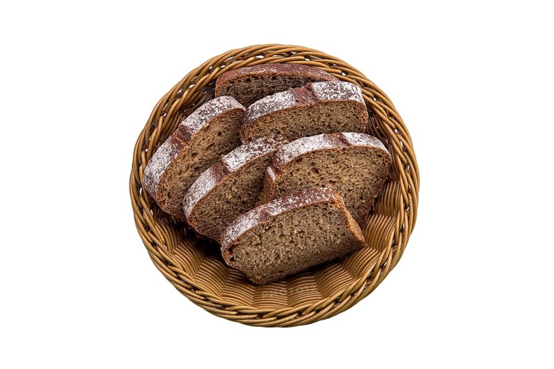 Top view of brown bread in basket isolated on white