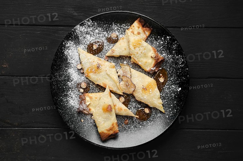 Top view of thin pancakes stuffed with pear