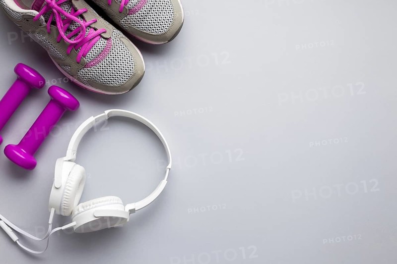 Top view pink sports attributes with headphones. Resolution and high quality beautiful photo