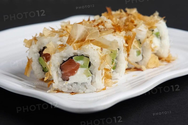 Close up view of bonito maki rolls with salmon