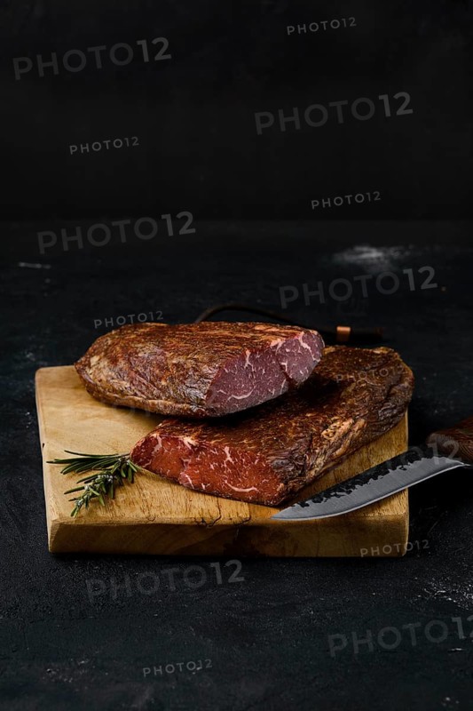 Smoked beef striploin meat on cutting board