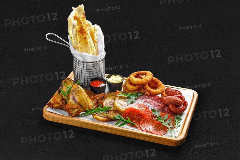 Big set of snack for beer on black background