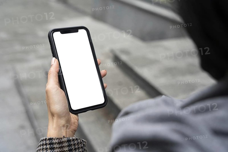 Close up hand holding phone
