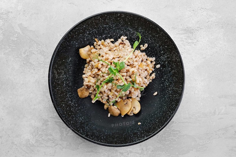 Boilet pearl barley with fried mushrooms