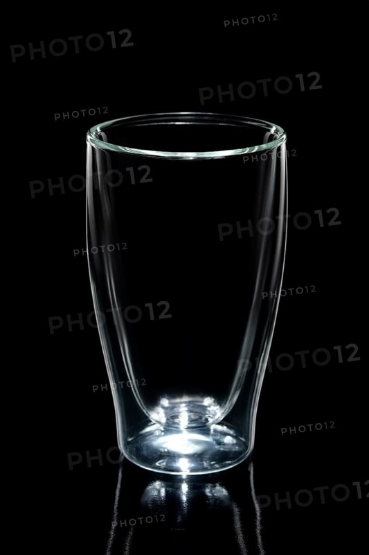 Empty double walled coffee glass isolated on black