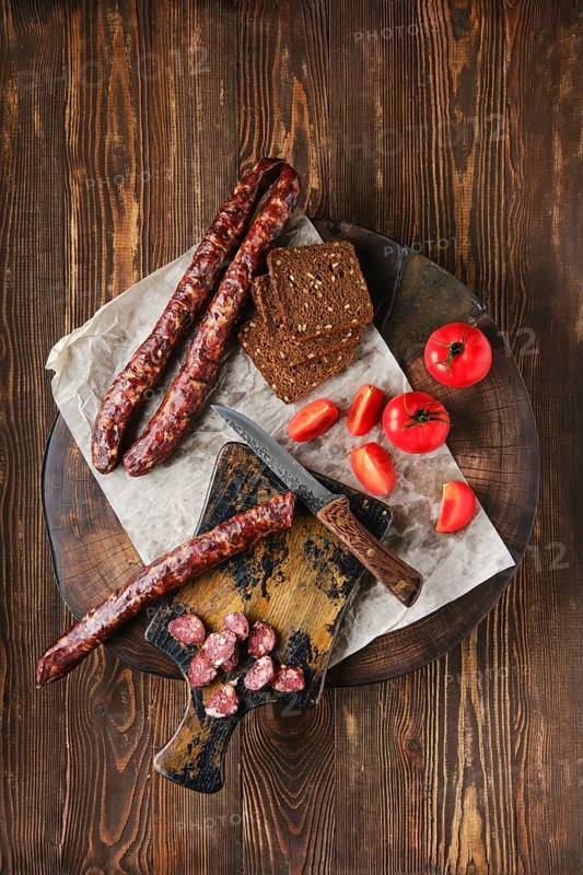 Overhead view of dried sausage made of venison spicy meat and lard