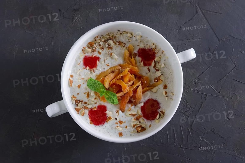 Plate of oatmeal with dried apricots