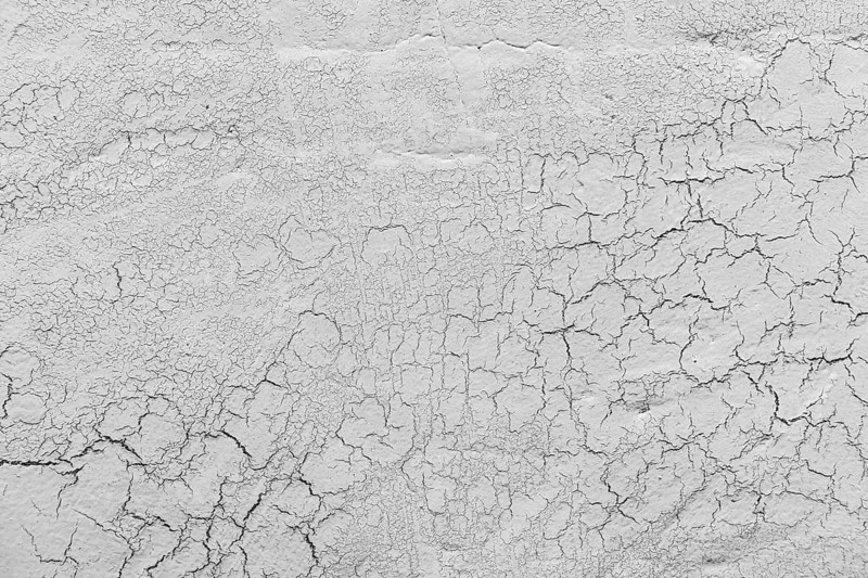 Grey lime plaster with cracks background