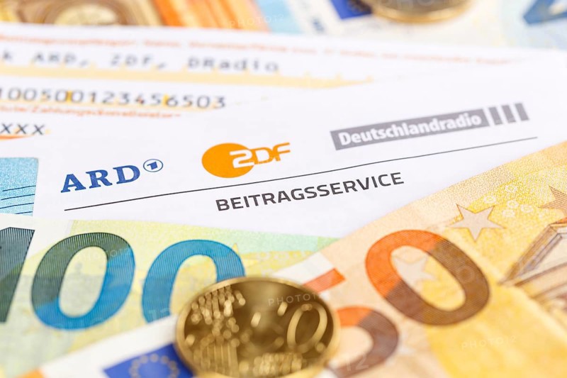 Contribution service of ARD and ZDF Rundfunkgebuehr GEZ with money in Stuttgart