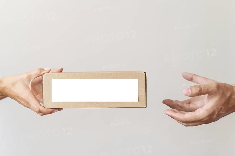 Hand giving donation box needy person