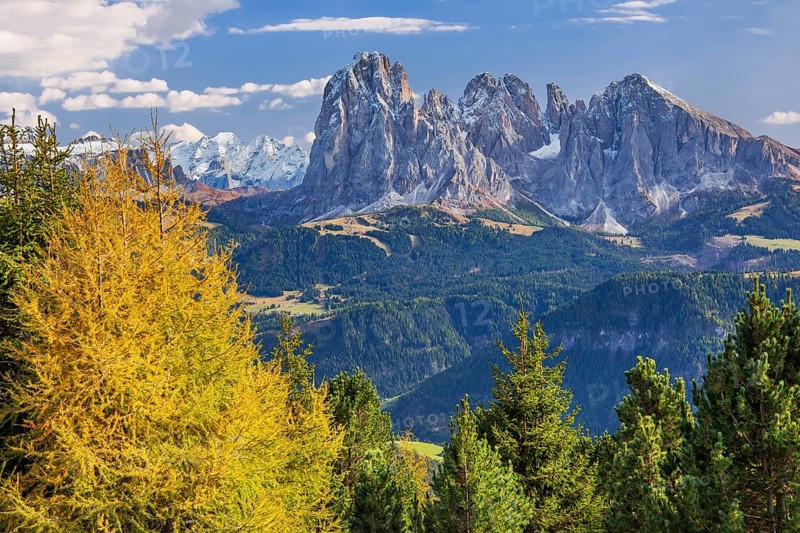View of the valley with Marmolata 3343m and Sassolungo group 3181m in early autumn