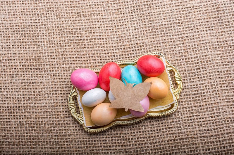 Paper Butterfly on Colorful candy sweets in tray