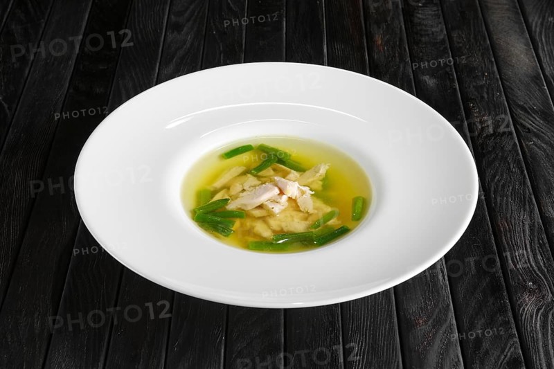 Clear broth with chicken and green beans