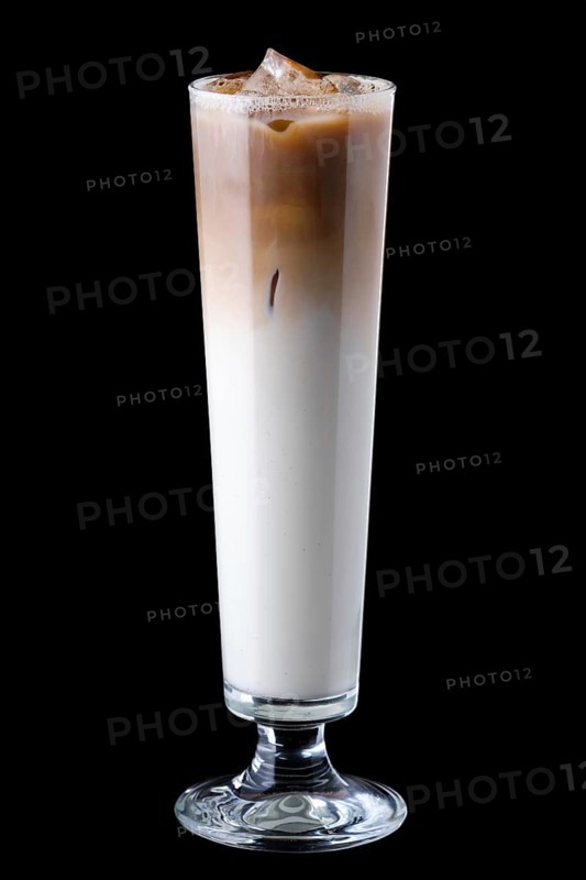 Tall narrow glass with iced coffee isolated on black background