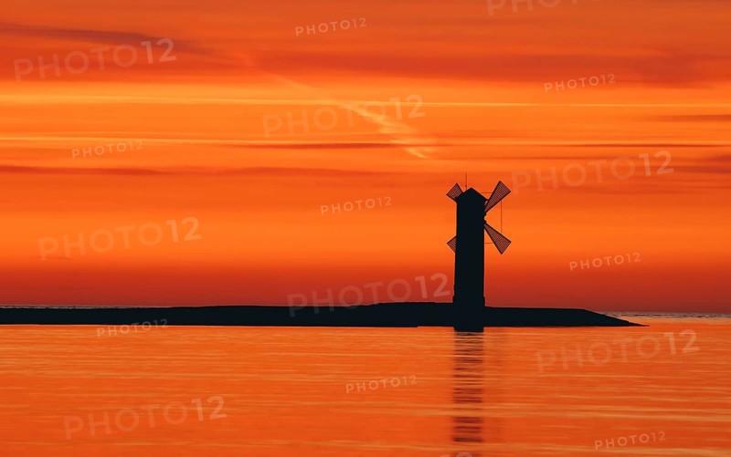 Beautiful sunset with a windmill in the background