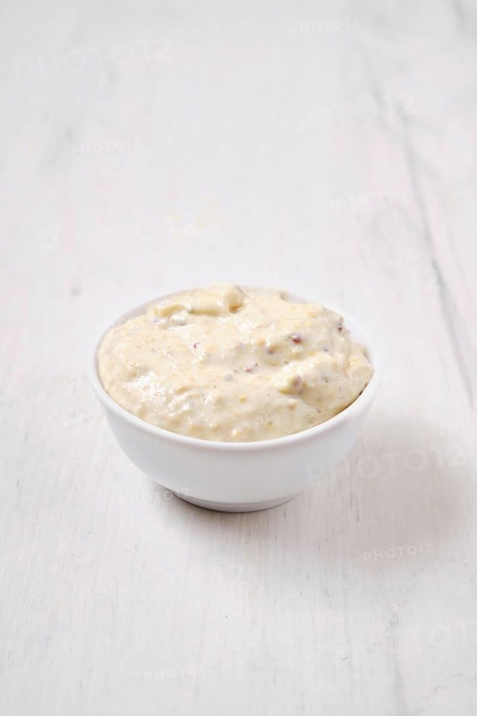 Small bowl with caesar sauce for salad