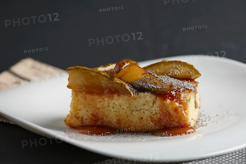 Piece of pear pie with poppy and sauce