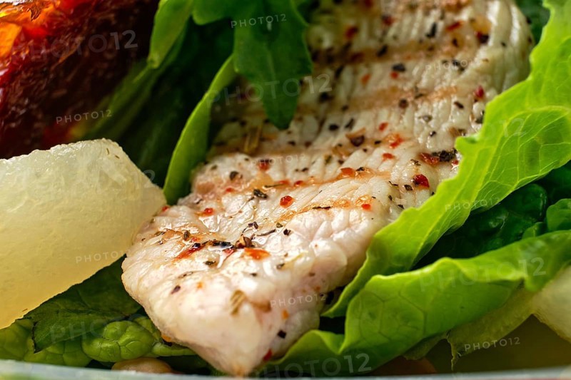 Macro photo of salad with roasted turkey