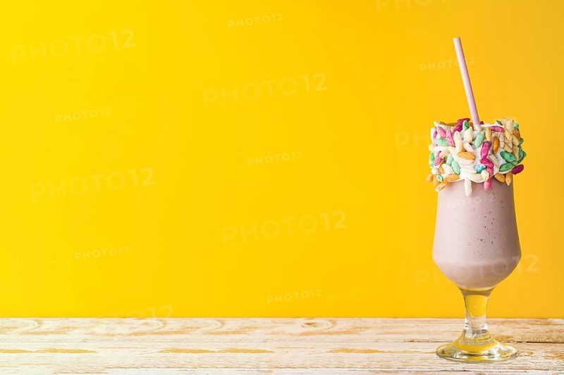 Front view delicious milkshake yellow background