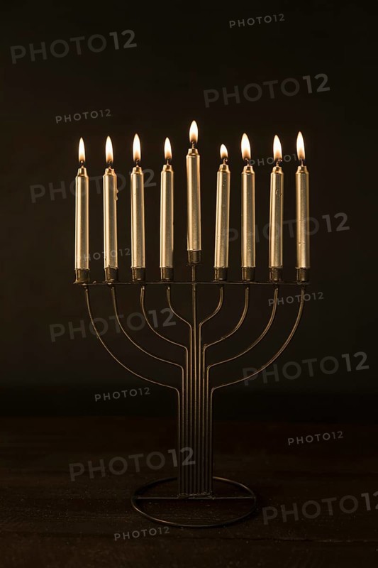 Menorah with golden burning candles