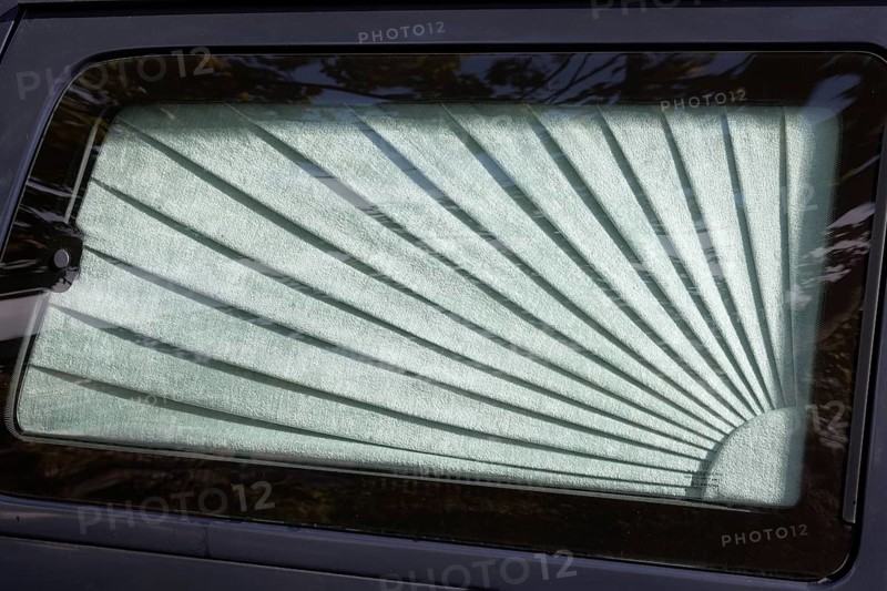 Car window with curtain on a hearse