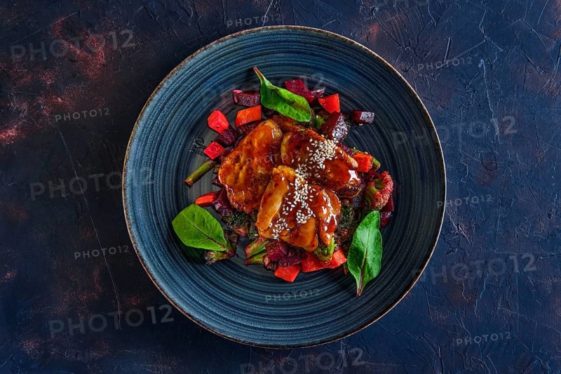 Top view of roasted pike served with beetroot