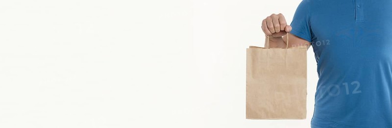 Man holding paper bag with copy space. Resolution and high quality beautiful photo