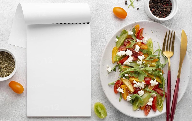 Top view tomato mix salad with feta cheese blank notebook. Resolution and high quality beautiful photo