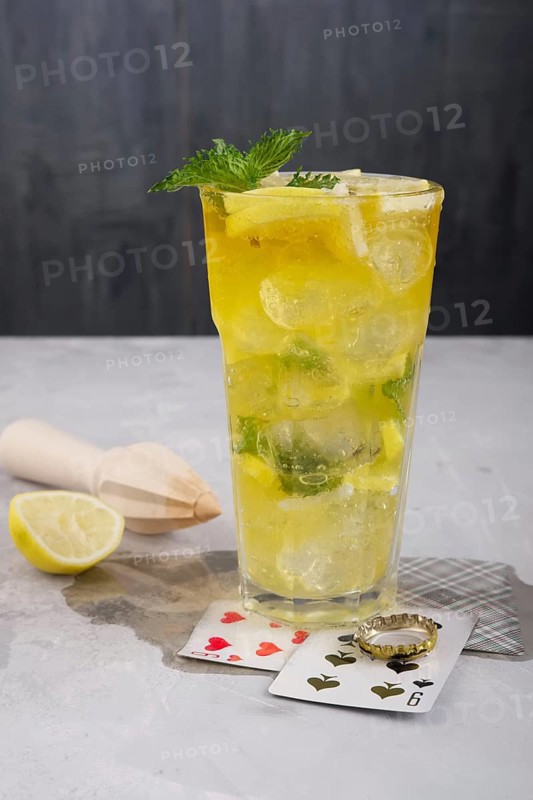 Faceted tall glass with cold citrus lemonade