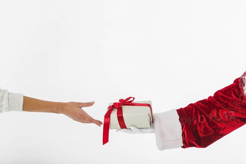 Young woman taking small gift box santa claus. Resolution and high quality beautiful photo