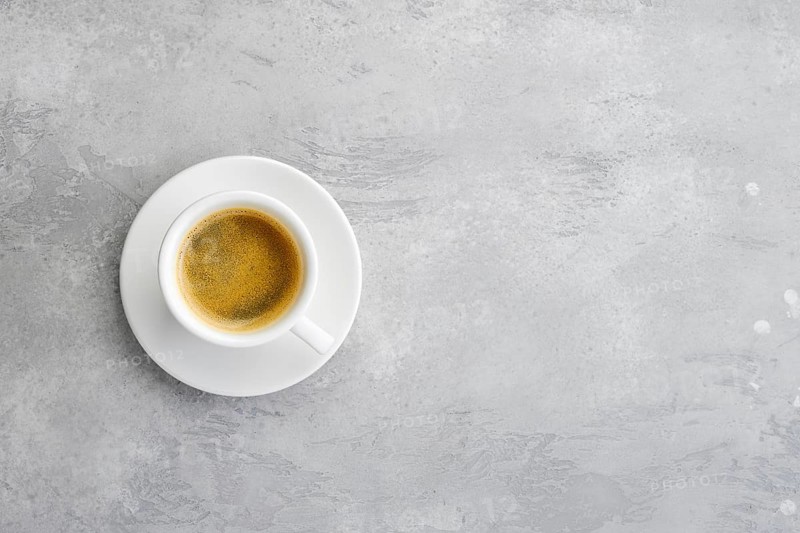 Overhead view of porcelain cup of strong coffee
