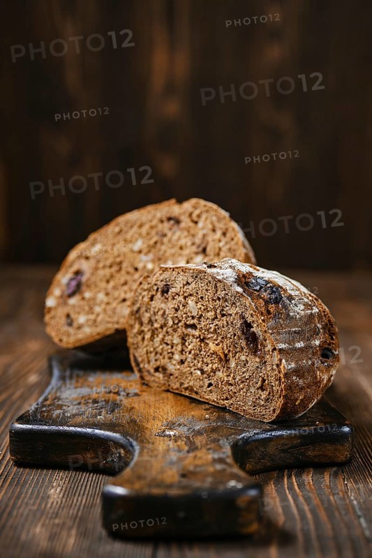 Closeup view of fresh rye brown bread on wooden cutting board