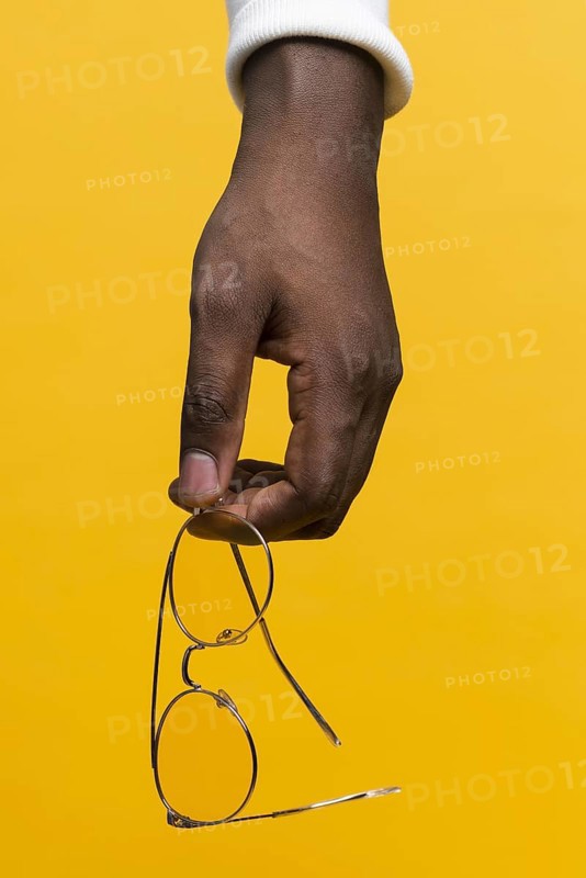 Hand holding glasses