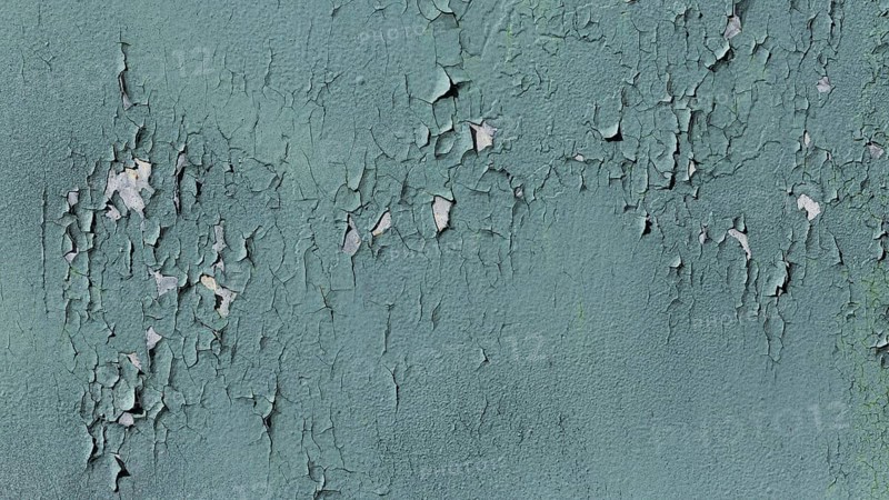 Old blue wall with fallen paint