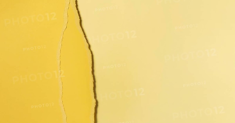 Different shades of torn yellow paper