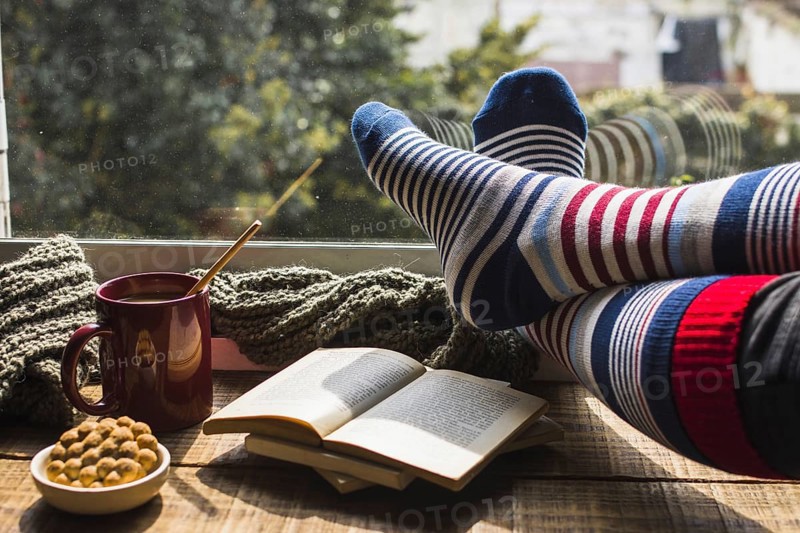 Legs striped socks near window