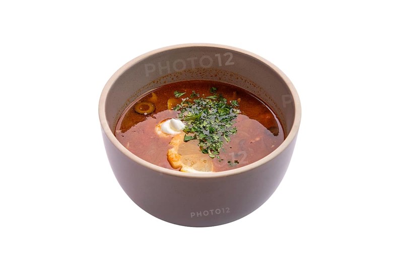 Traditional solyanka soup isolated on white