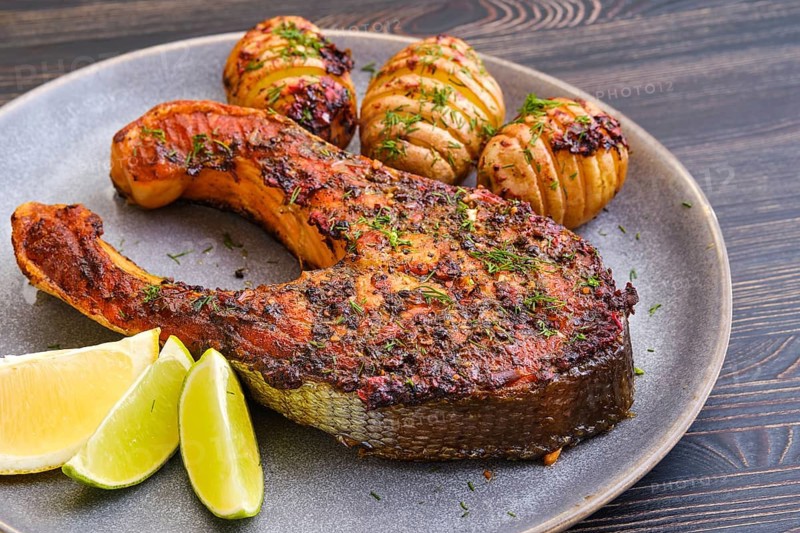 Baked salmon steak with hasselback potato
