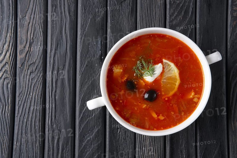 Top view of traditional rustic saltwort soup solyanka