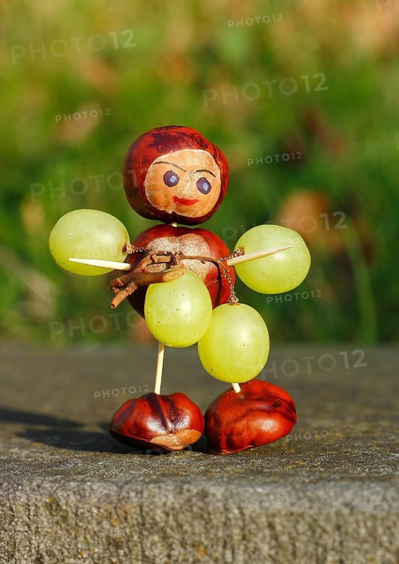 Chestnut figure with grapes in the evening light