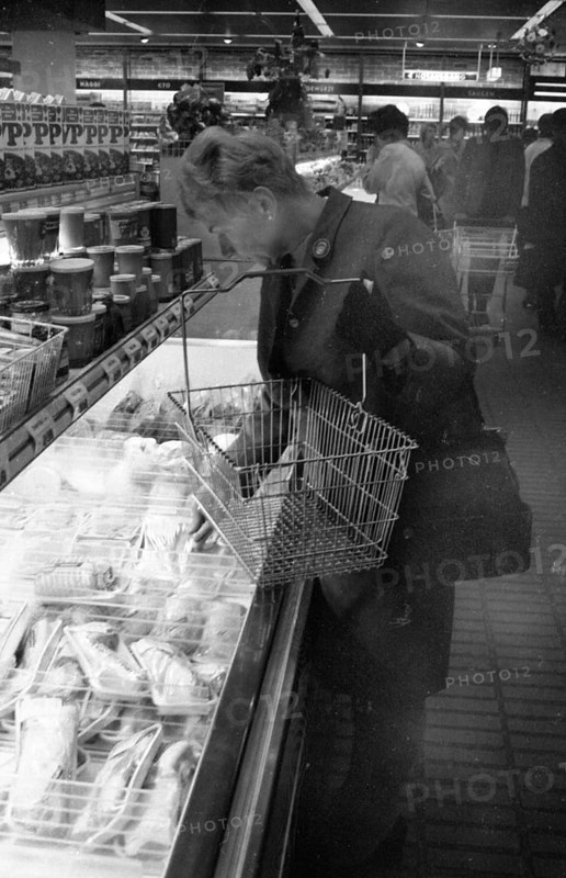 The work of a housewife and mother shopping for groceries at the supermarket and Aldi