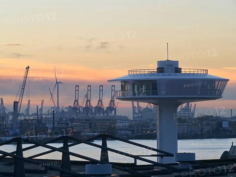 Lighthouse Zero on the Norderelbe in Hamburg's Hafencity against the backdrop of the container terminals and harbour cranes. Harbour