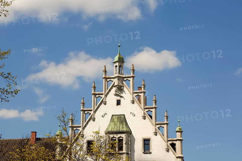 House with stone figure and turret