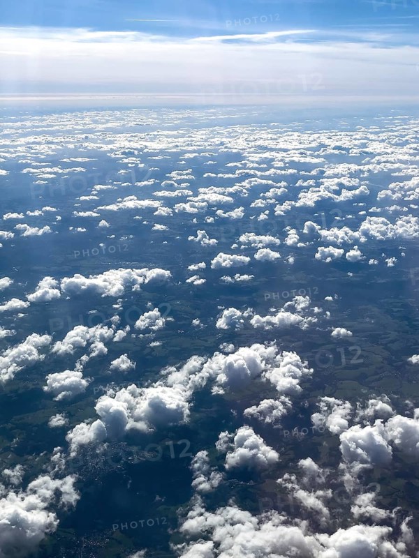 View from aeroplane of cluster clouds Altocumulus clouds Sheep clouds in the background Altostratus