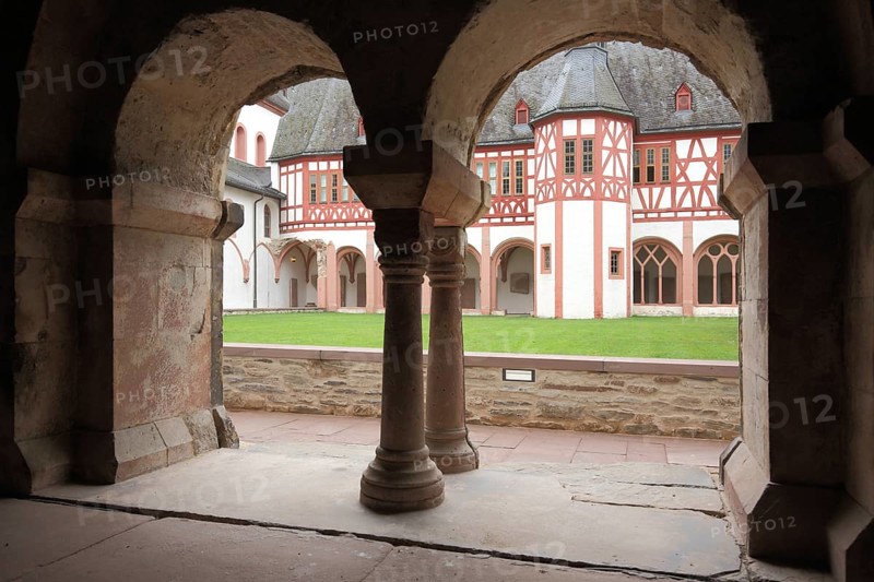 View through chapter house with two archways and columns to the inner courtyard in UNESCO Kloster Eberbach