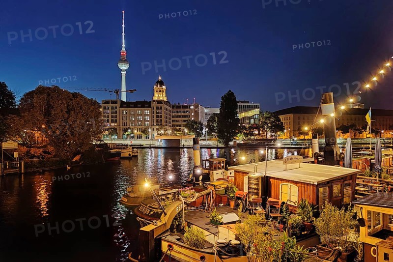 Historic harbour with museum ships and television tower in the blue hour