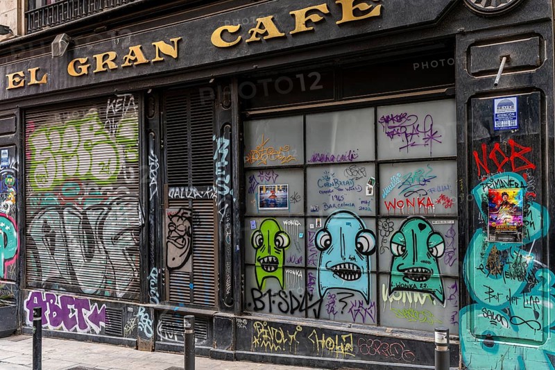 Graffiti on the blinds of vacant shops in the old town of Barcelona
