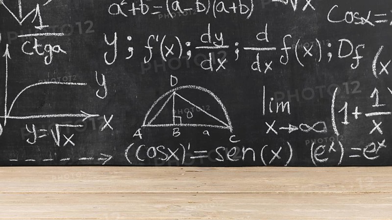Black chalkboard with mathematical problems